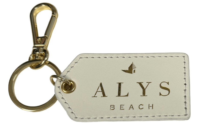 Keychain with 'ALYS BEACH' logo on a white background